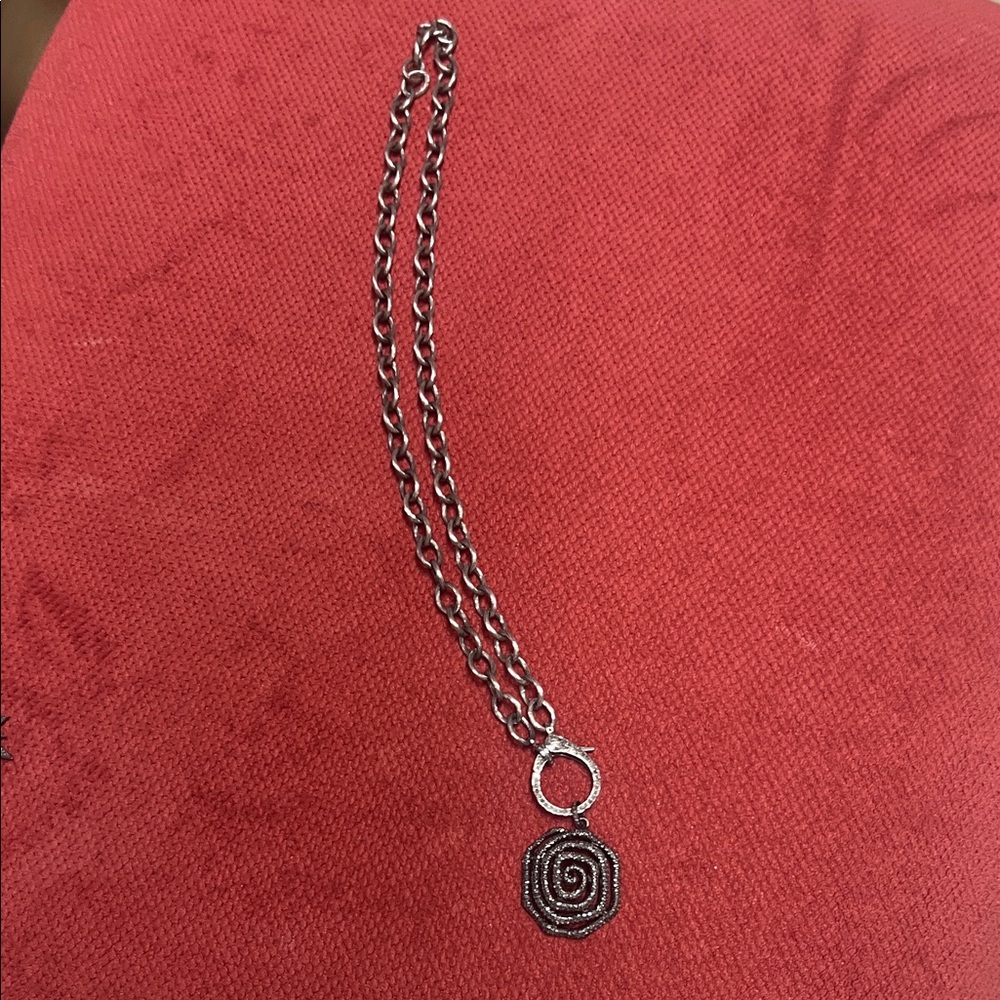 Elegant Silver Spiral Pendant Necklace
Diamond clasp and diamonds on pendent